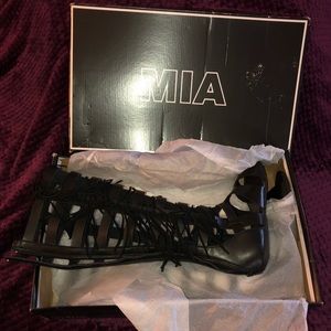 Black gladiator sandal size 8, never been worn.
